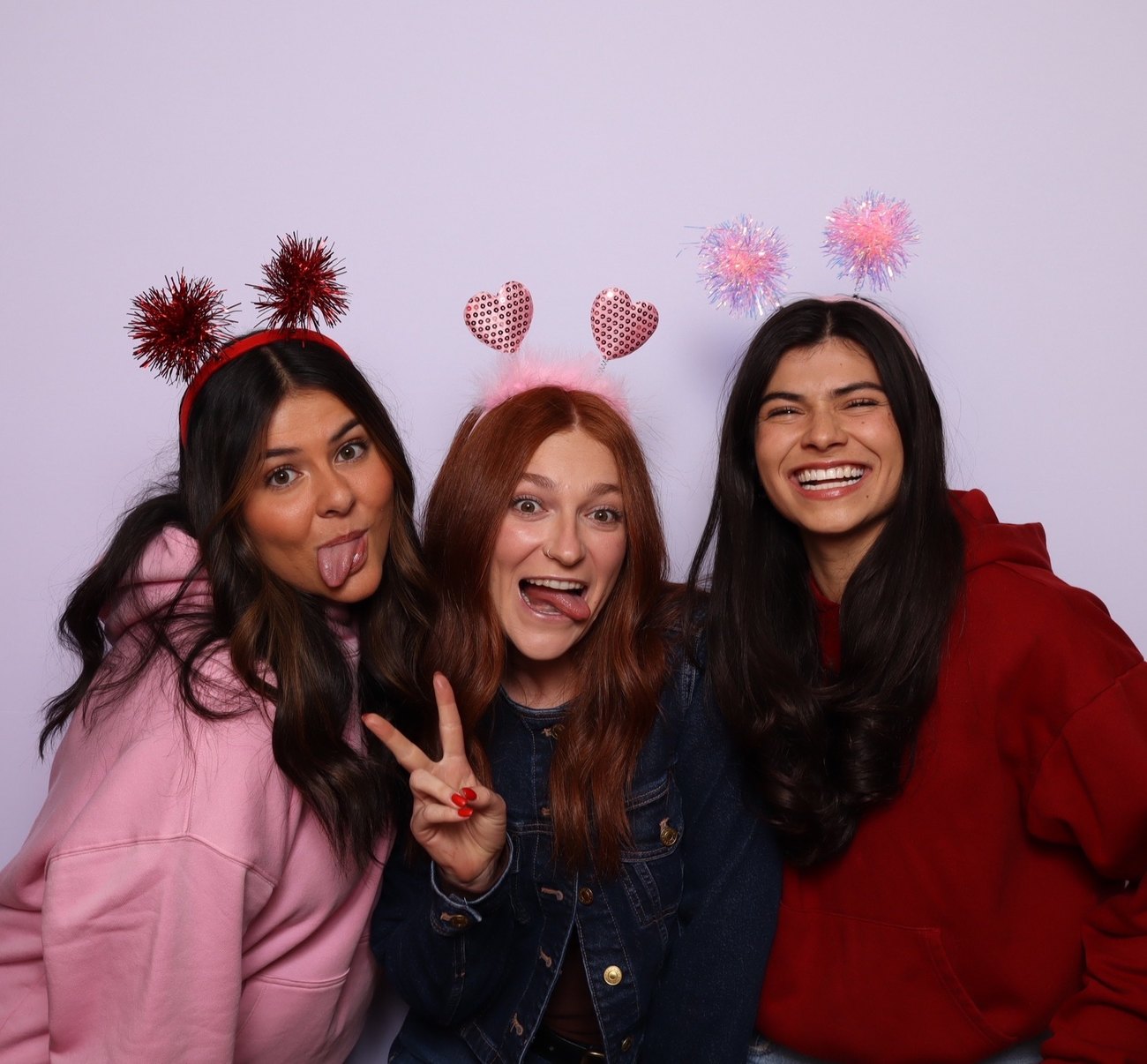 Guests together in front of the booth backdrop