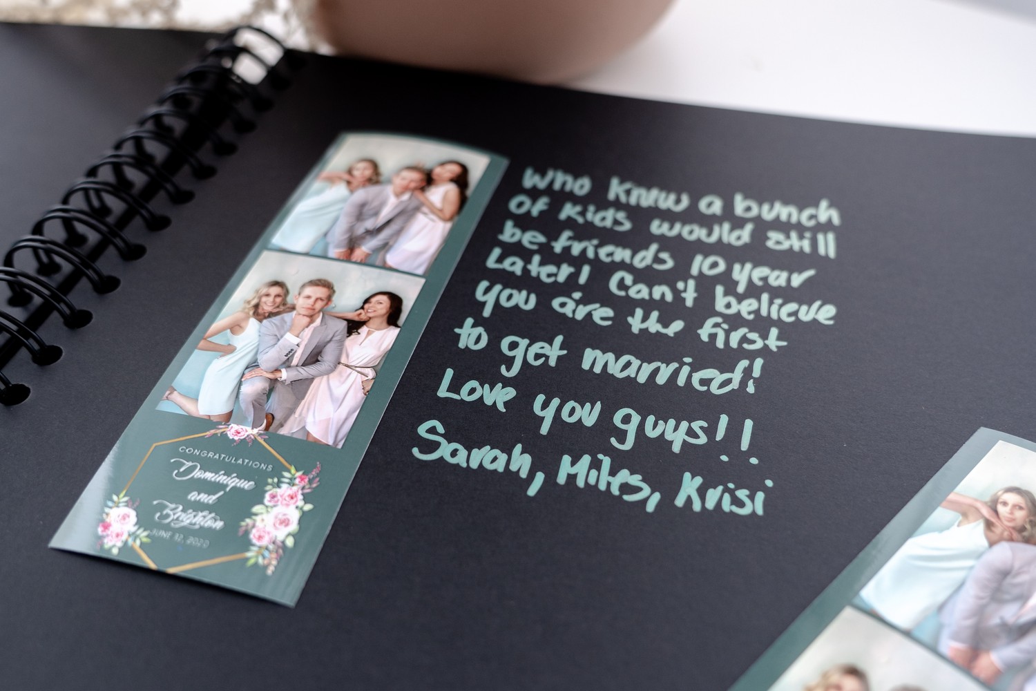 A guest book with photo strips and handwritten messages from guests