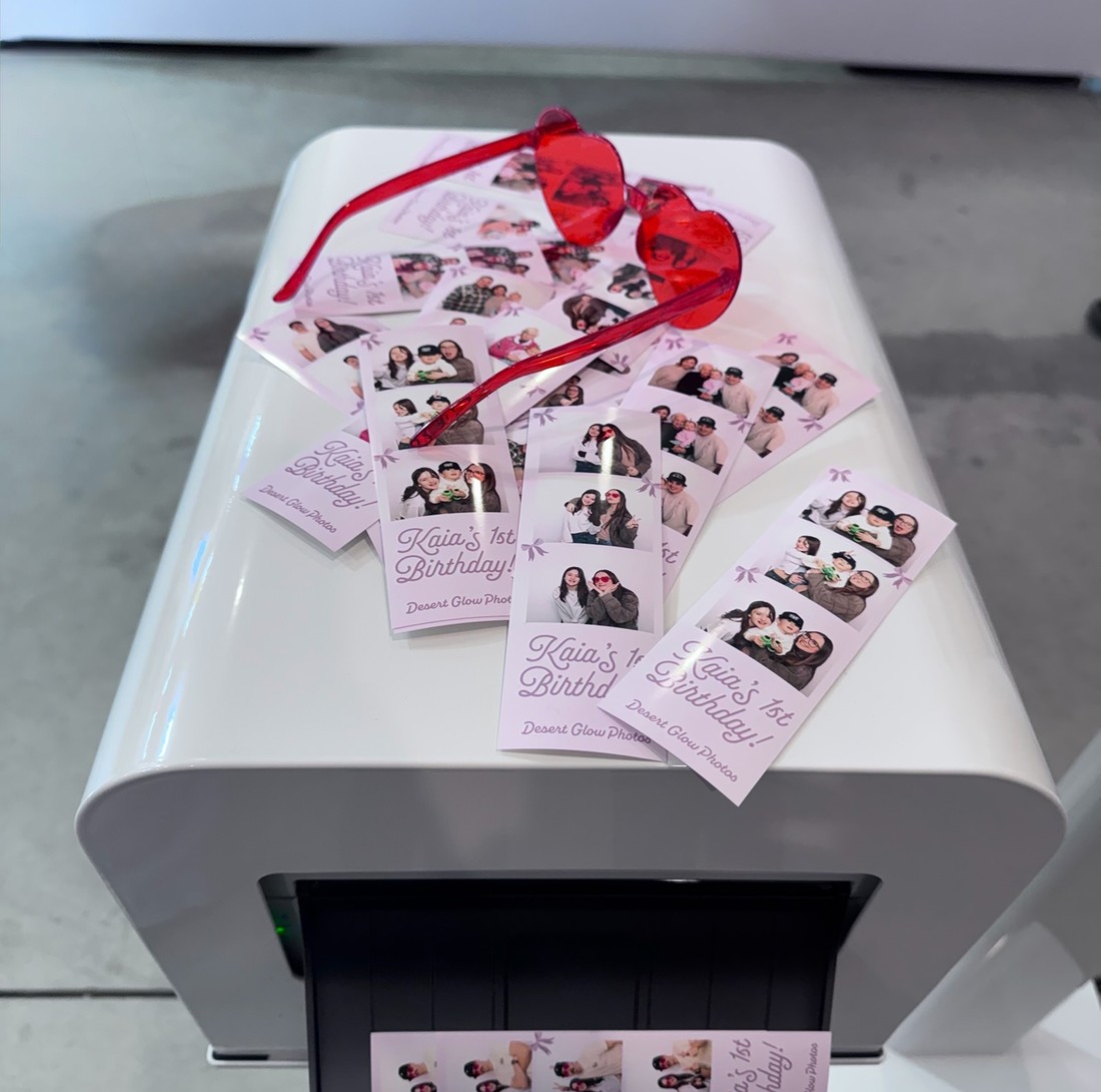 Photo strips coming off the booth printer