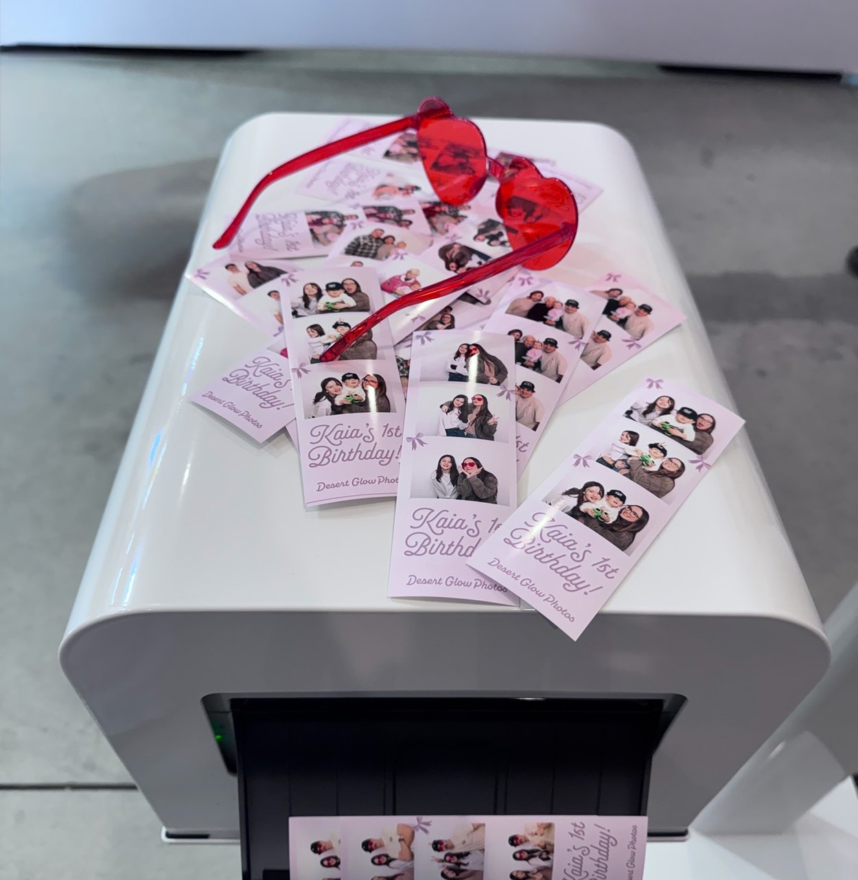 Photo strips coming off the booth printer