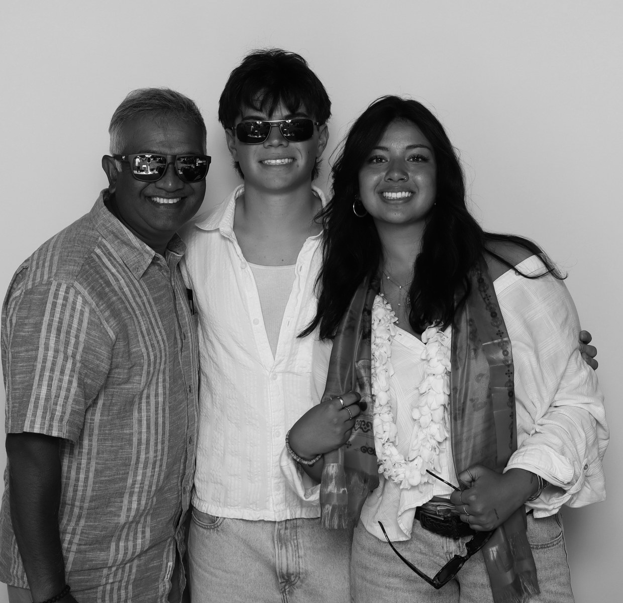 Three guests posing together in the booth