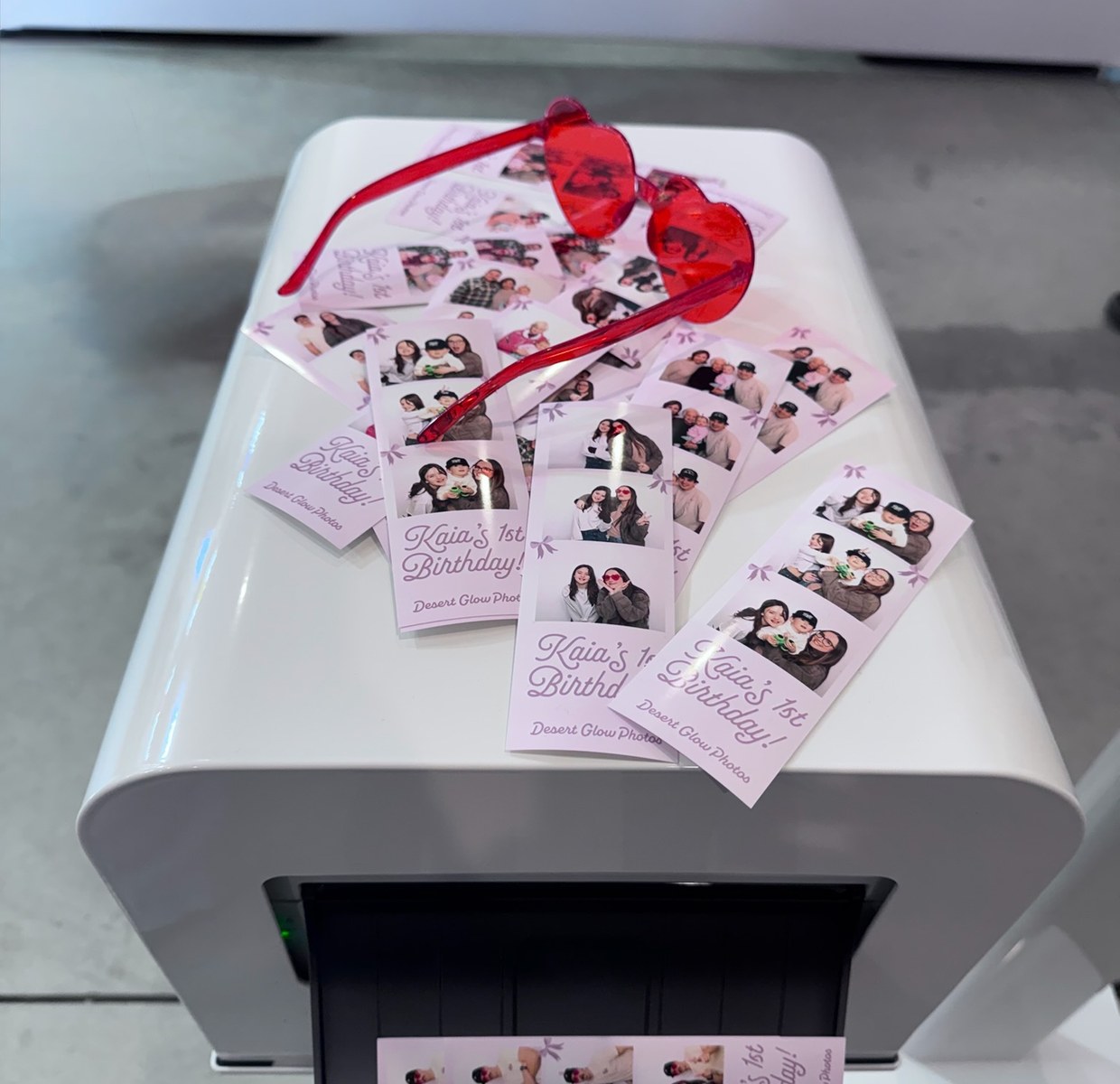 Custom photo strips coming off the booth printer